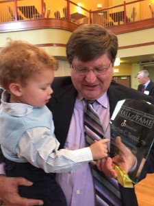 Papa showing Alexander his "trophy"